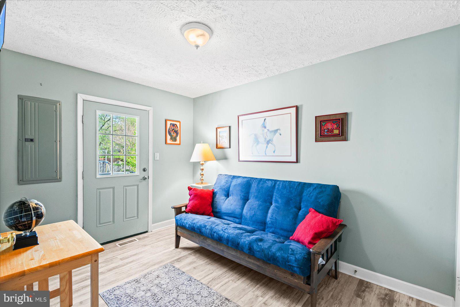 720 Bancroft Avenue Colonial Beach, VA 22443 - Photo 22 of 59 a living room with furniture and a window