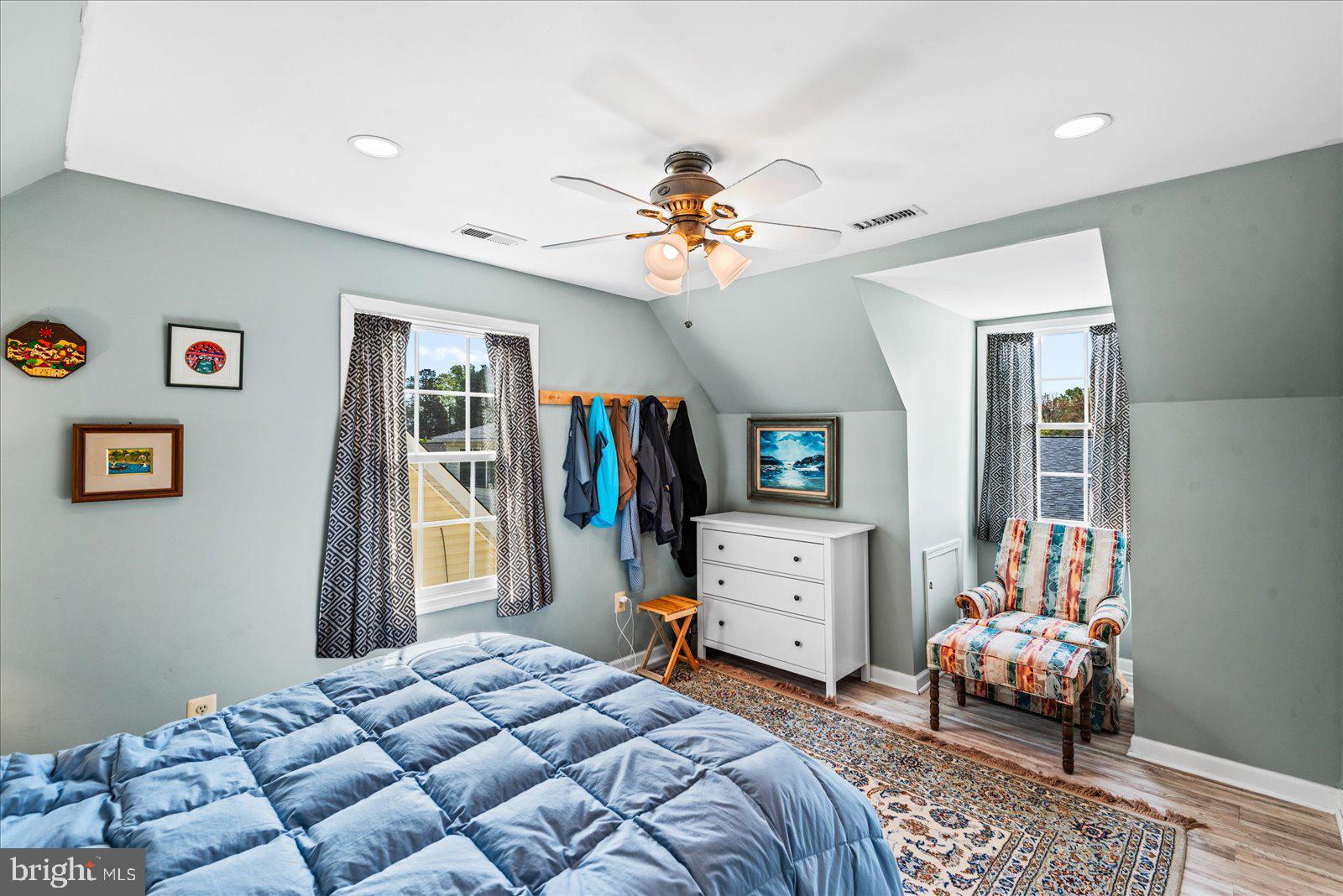 720 Bancroft Avenue Colonial Beach, VA 22443 - Photo 27 of 59 a bedroom with furniture and a flat screen tv