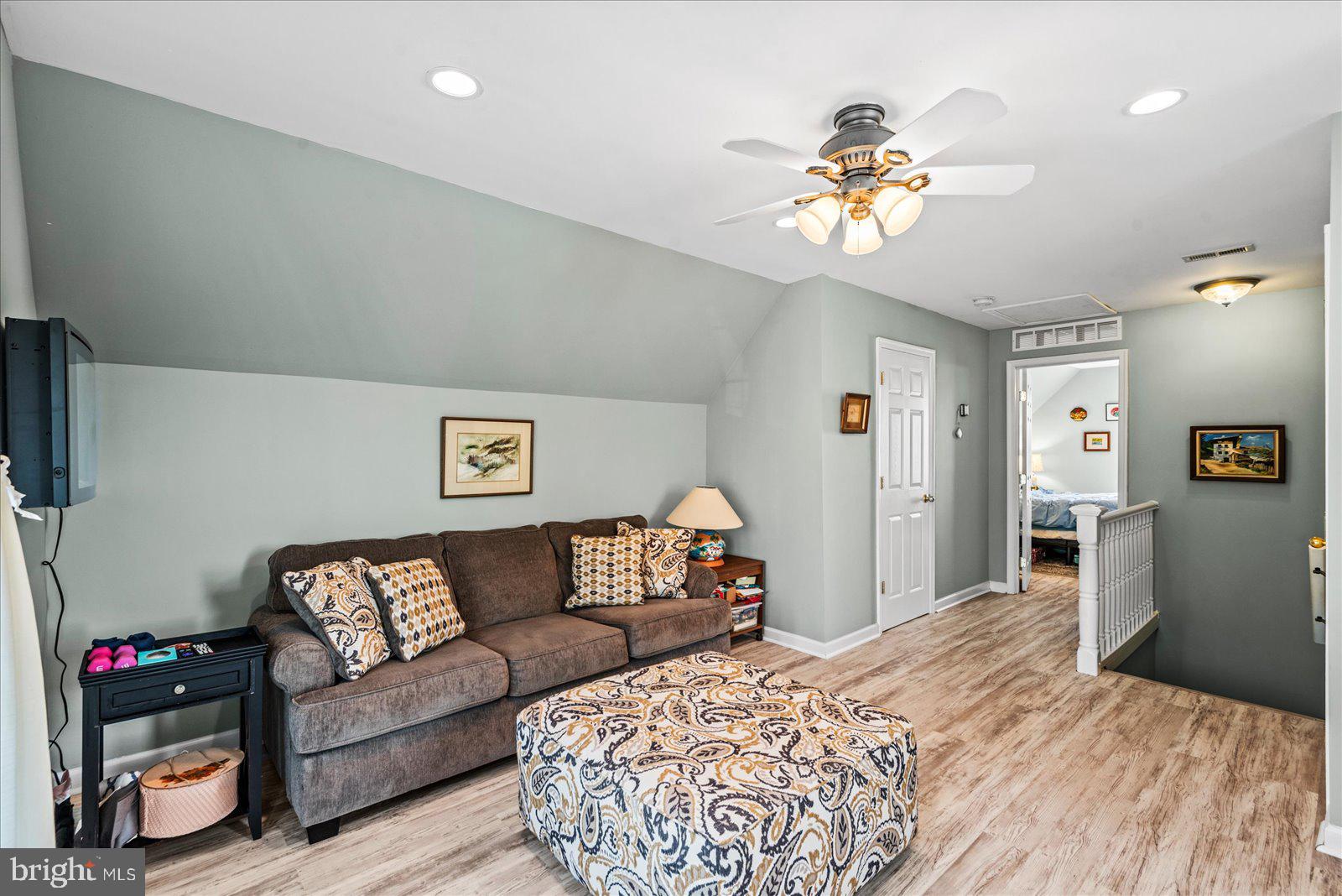 720 Bancroft Avenue Colonial Beach, VA 22443 - Photo 32 of 59 a bedroom with a bed mirror and couch