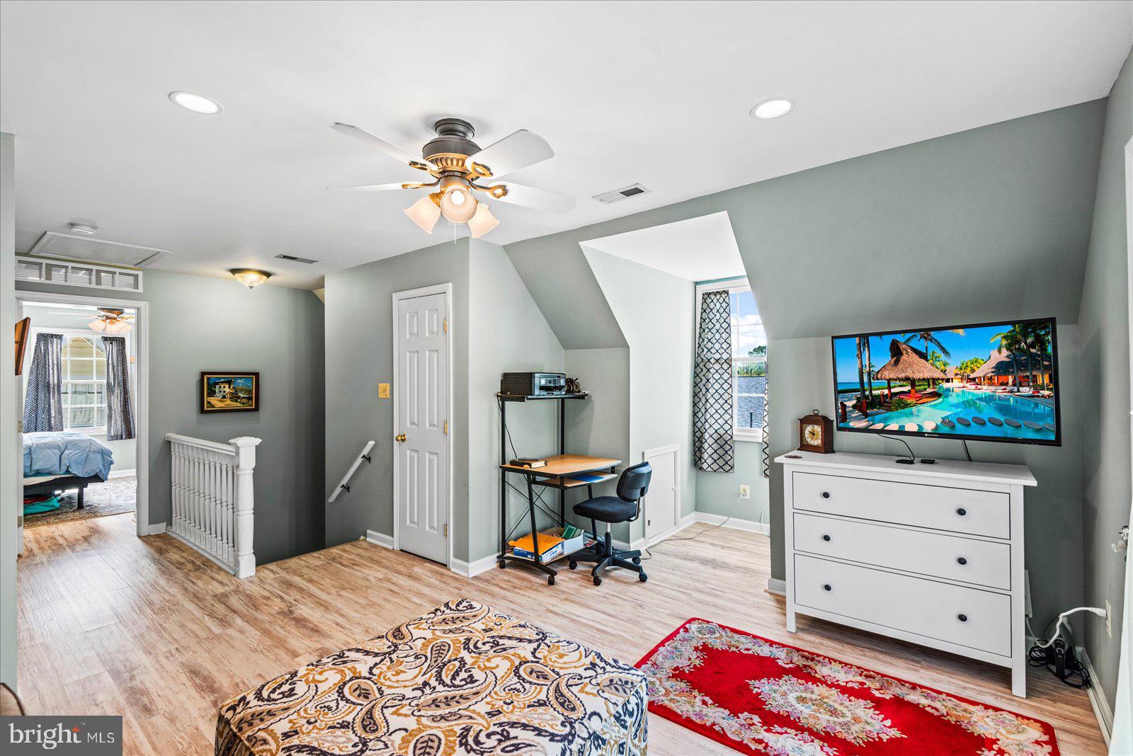 720 Bancroft Avenue Colonial Beach, VA 22443 - Photo 35 of 59 a living room with furniture and a flat screen tv