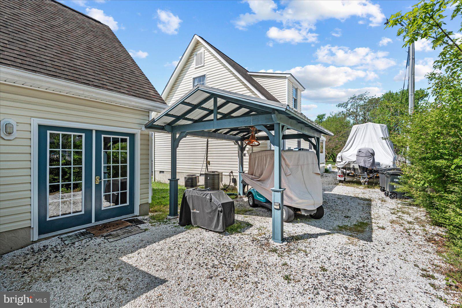 720 Bancroft Avenue Colonial Beach, VA 22443 - Photo 38 of 59 a view of a chairs and table in backyard