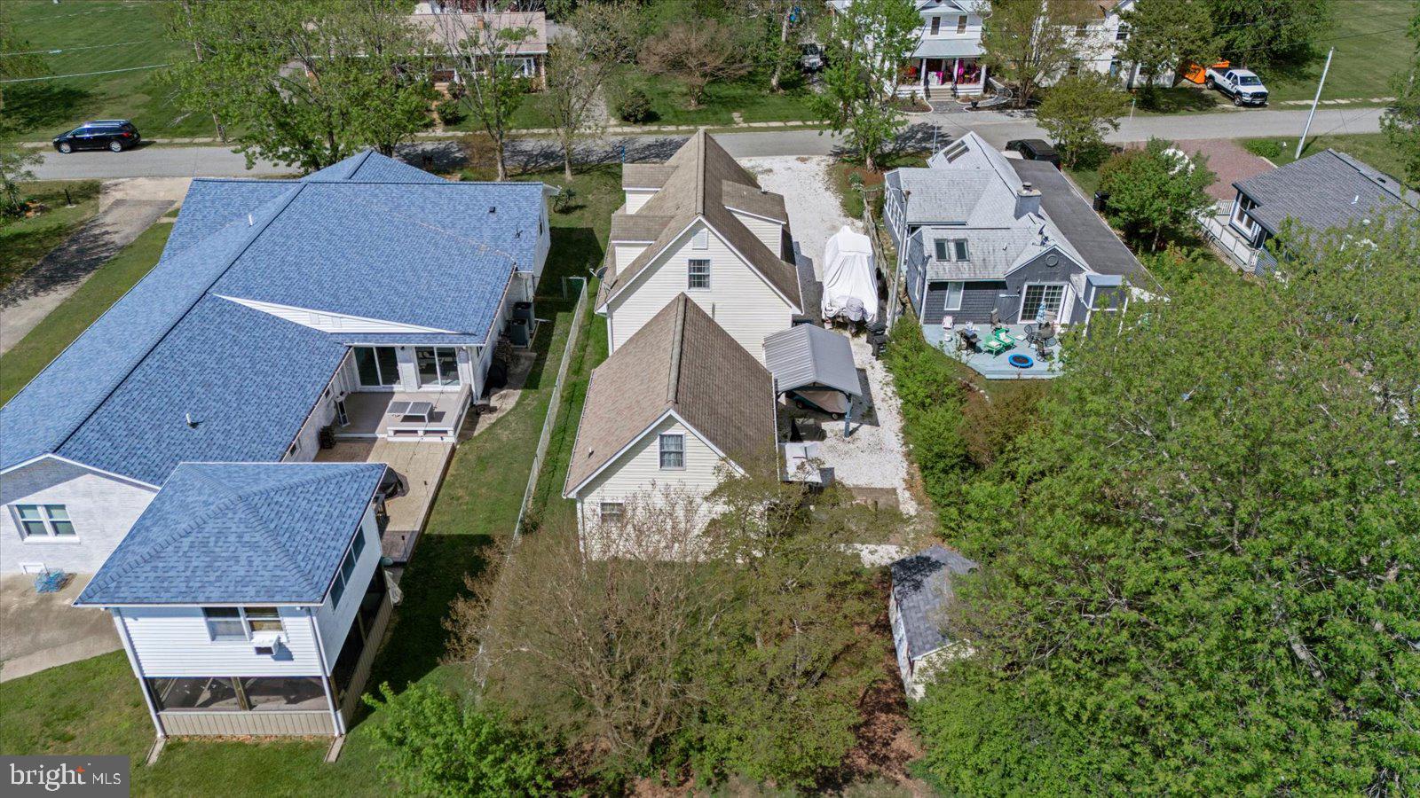 720 Bancroft Avenue Colonial Beach, VA 22443 - Photo 52 of 59 an aerial view of residential houses with outdoor space and trees