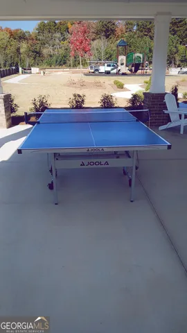 a view of room with wooden floor and white walls