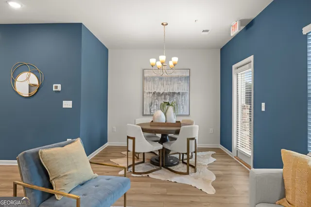 a workspace with furniture window and wooden floor