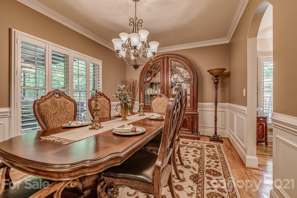 4367 Lake Shore Road North Denver, NC 28037 - Photo 11 of 48 a view of a dining room with furniture window and wooden floor