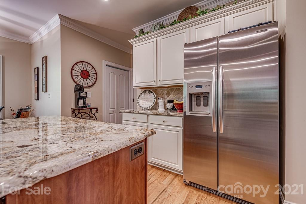 4367 Lake Shore Road North Denver, NC 28037 - Photo 14 of 48 a kitchen with stainless steel appliances granite countertop a refrigerator and a sink