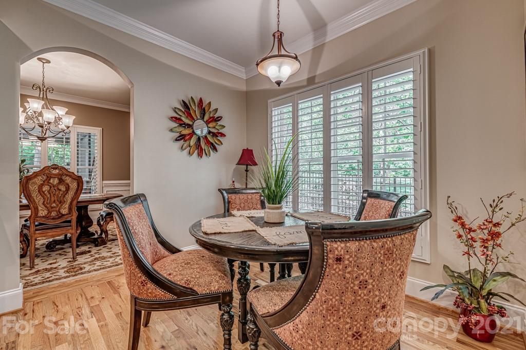4367 Lake Shore Road North Denver, NC 28037 - Photo 15 of 48 a view of a dining room with furniture and chandelier