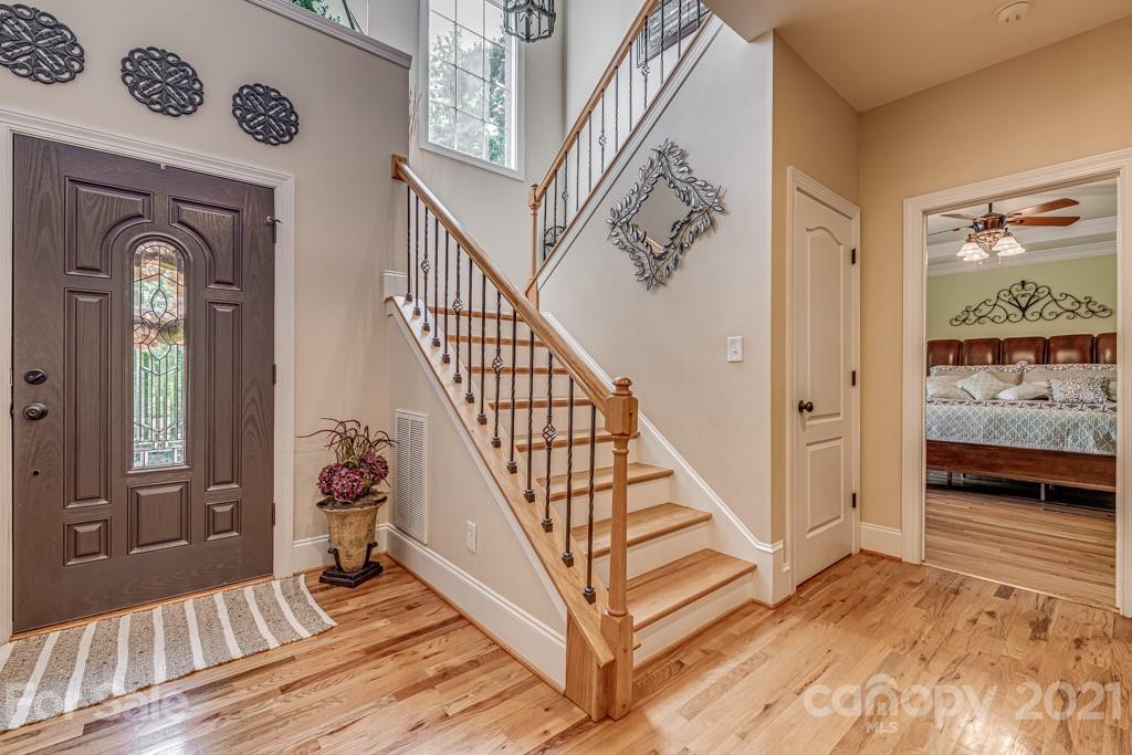 4367 Lake Shore Road North Denver, NC 28037 - Photo 18 of 48 a view of a hallway with wooden floor and stairs