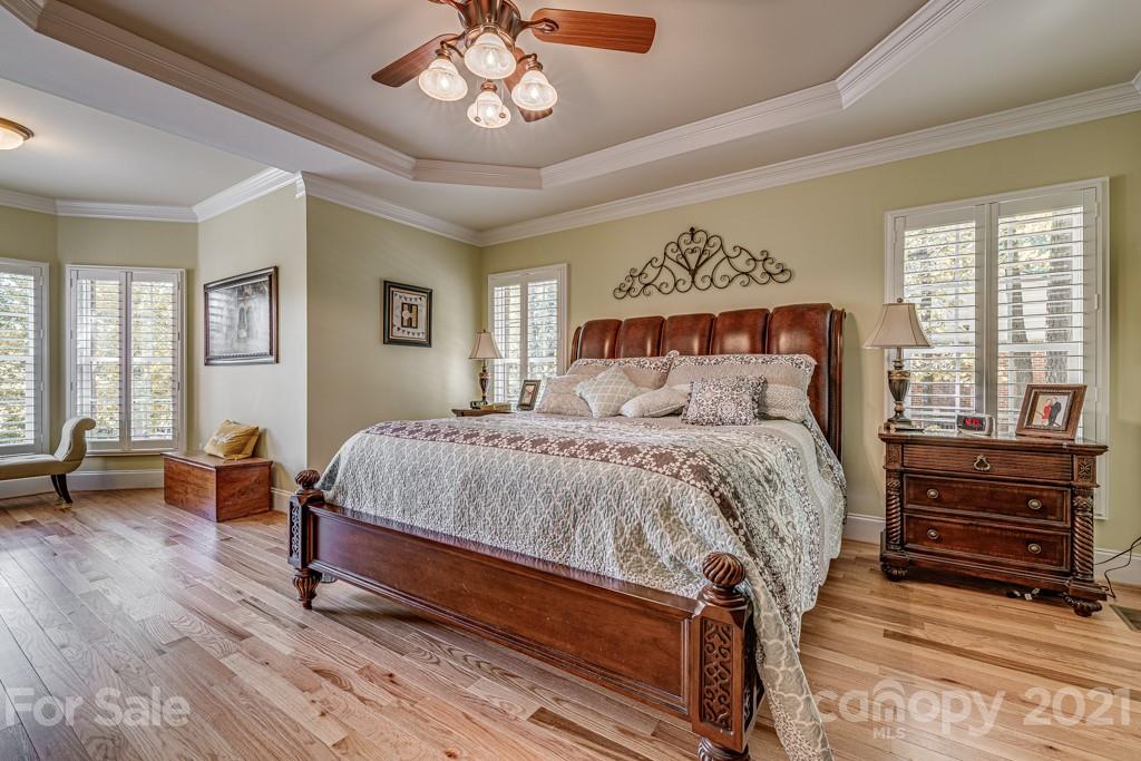 4367 Lake Shore Road North Denver, NC 28037 - Photo 19 of 48 a bed sitting in a spacious bedroom next to a window