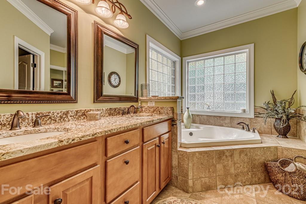 4367 Lake Shore Road North Denver, NC 28037 - Photo 22 of 48 a spacious bathroom with a tub sink and mirror