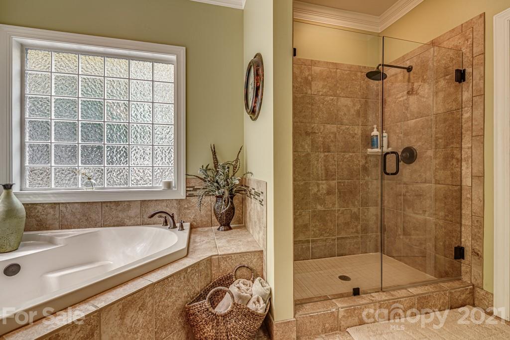 4367 Lake Shore Road North Denver, NC 28037 - Photo 24 of 48 a bathroom with a bathtub and a shower