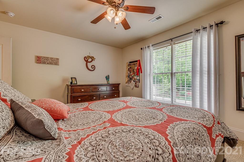 4367 Lake Shore Road North Denver, NC 28037 - Photo 29 of 48 a bedroom with a bed dresser and a window