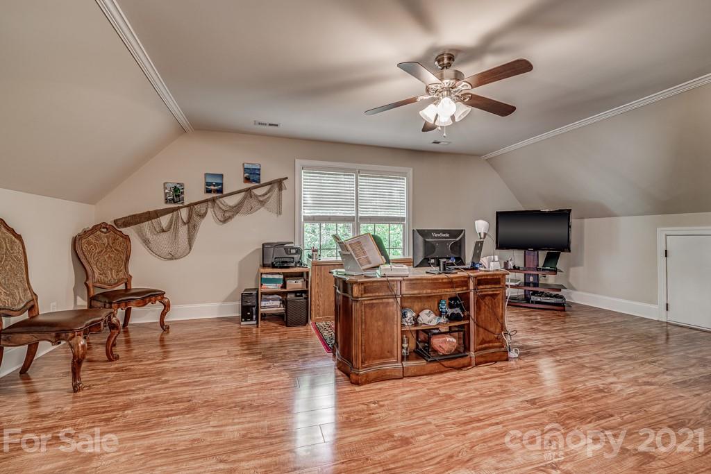 4367 Lake Shore Road North Denver, NC 28037 - Photo 35 of 48 a living room with furniture and wooden floor