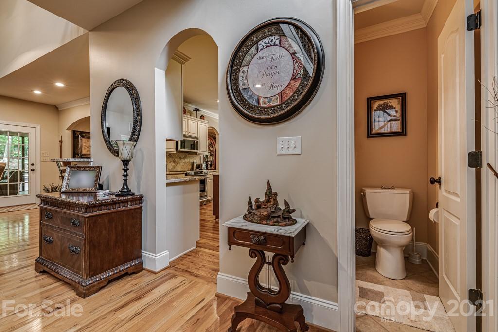 4367 Lake Shore Road North Denver, NC 28037 - Photo 5 of 48 a view of a workspace with furniture and wooden floor