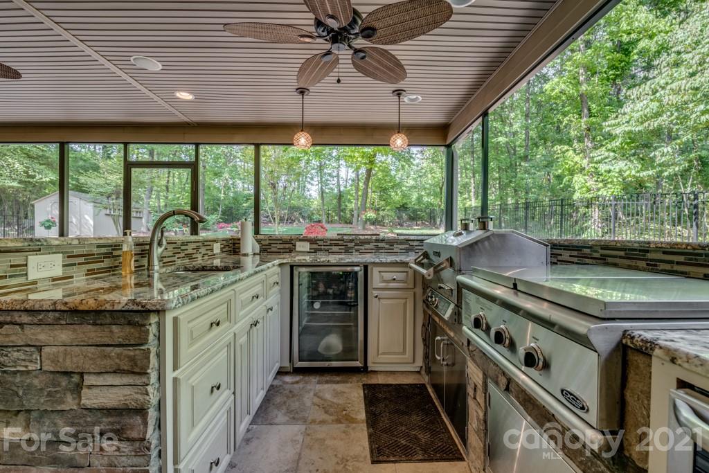 4367 Lake Shore Road North Denver, NC 28037 - Photo 41 of 48 a kitchen with stainless steel appliances granite countertop a stove and a sink
