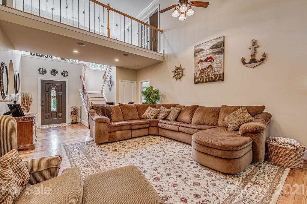 4367 Lake Shore Road North Denver, NC 28037 - Photo 6 of 48 a living room with furniture and a chandelier