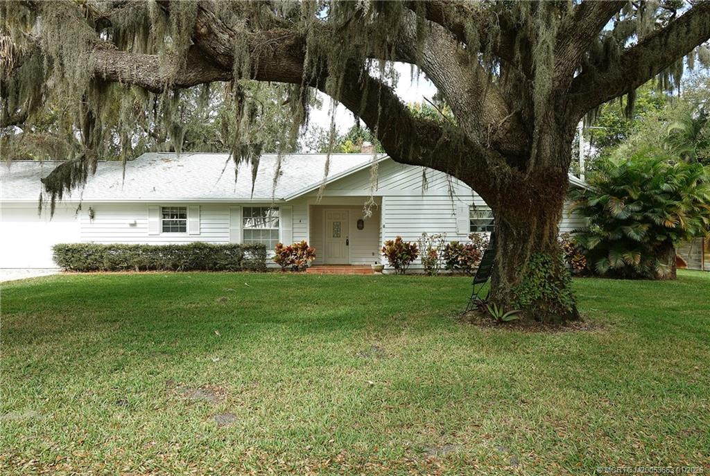 4 Miramar Road Sewall's Point, FL 34996 - Photo 3 of 31 a view of an house with backyard space and garden