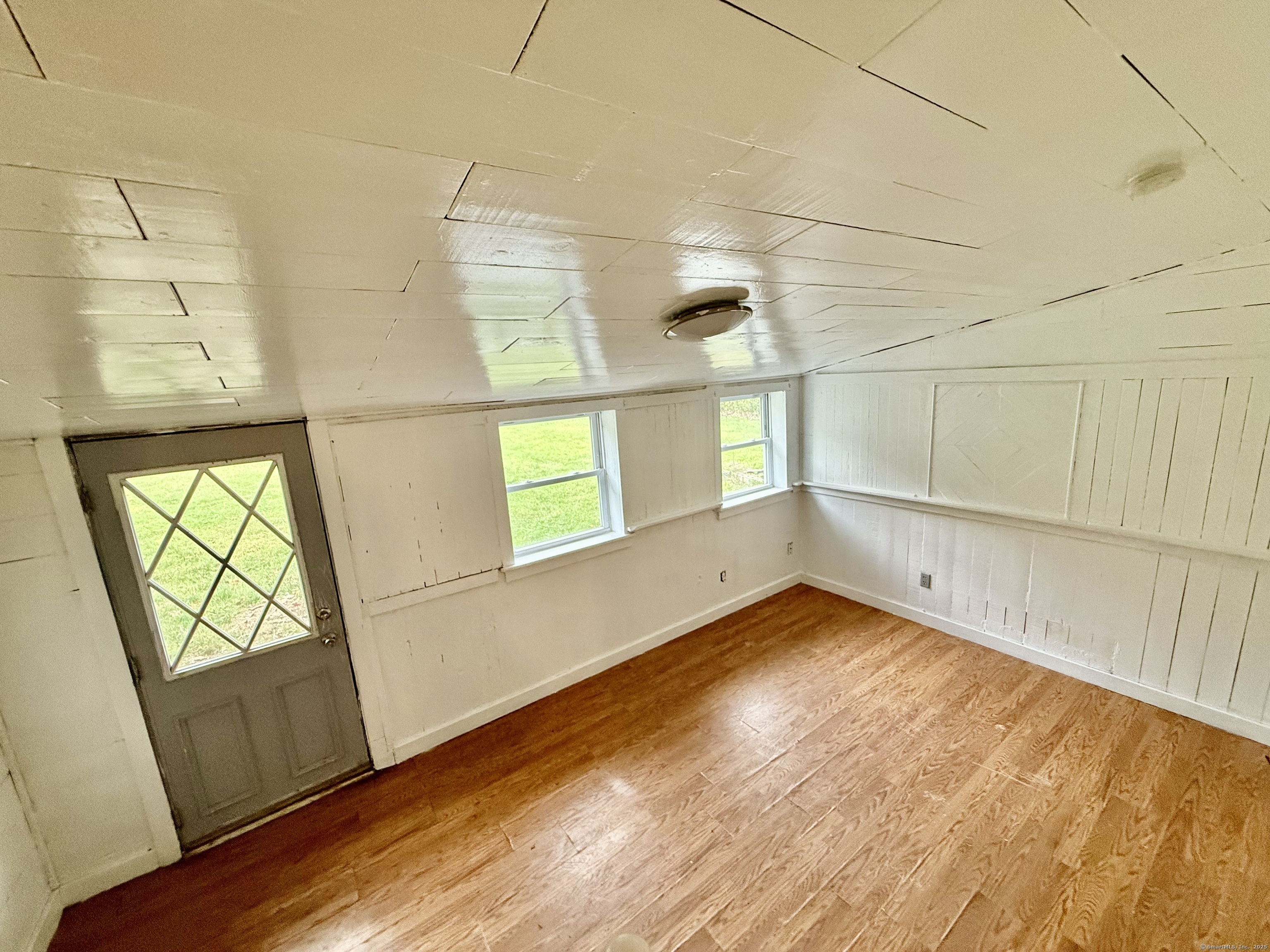 243 Champion Road Franklin, CT 06254 - Photo 10 of 13 a view of empty room with wooden floor and fan