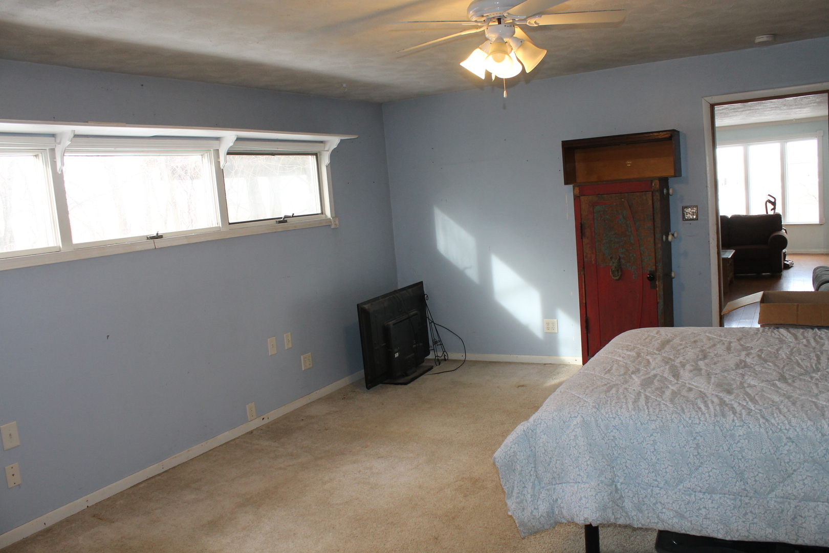 16038 Quigley Road Sycamore, IL 60178 - Photo 16 of 42 a bedroom with a bed and a chandelier