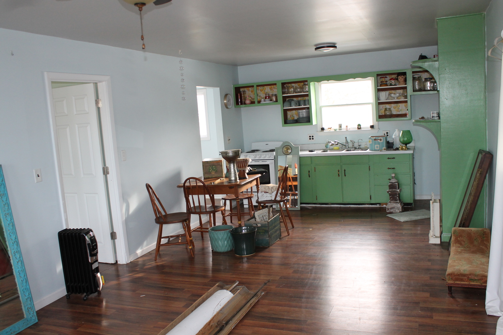 16038 Quigley Road Sycamore, IL 60178 - Photo 39 of 42 a dining room with furniture and wooden floor