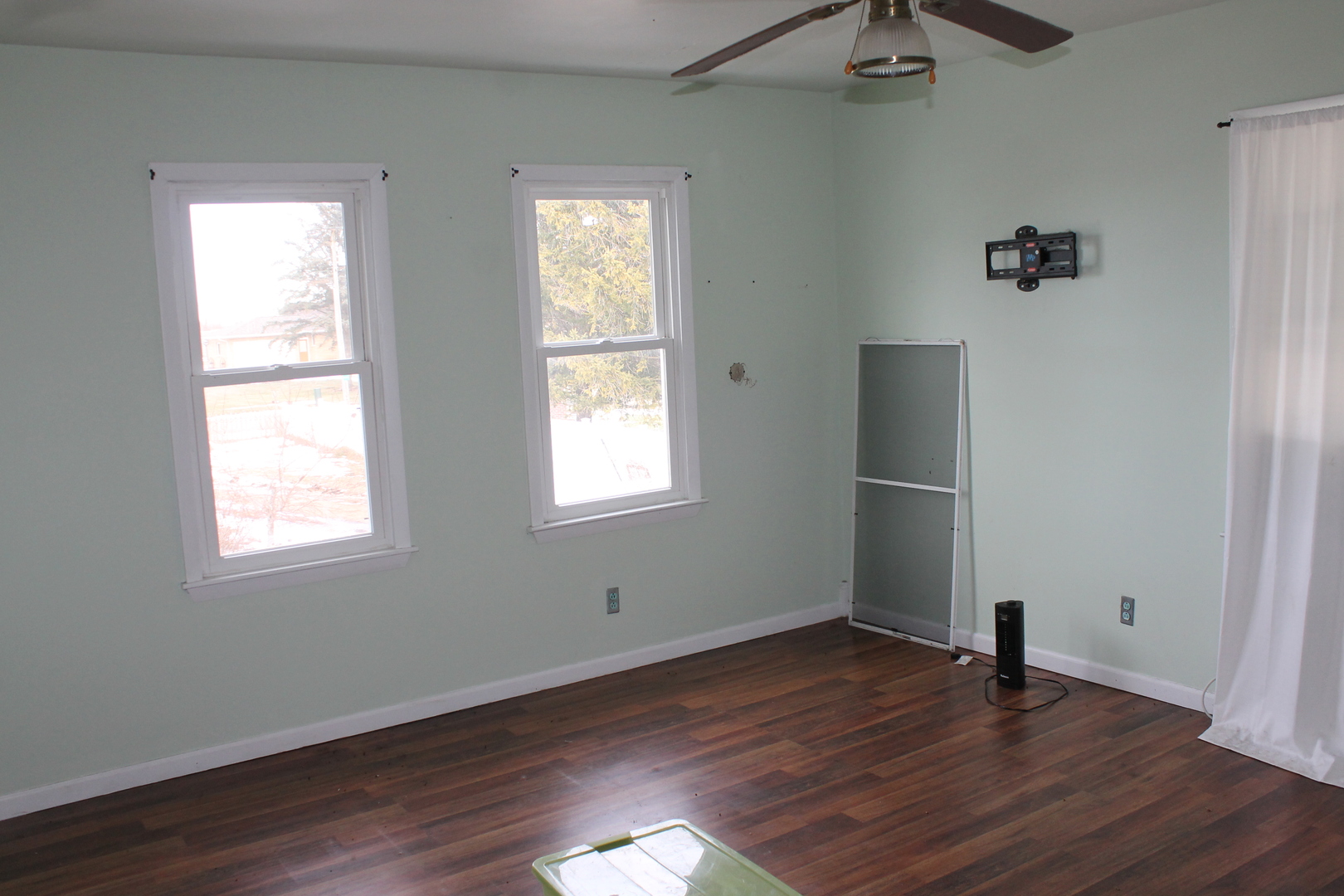 16038 Quigley Road Sycamore, IL 60178 - Photo 40 of 42 an empty room with wooden floor and windows