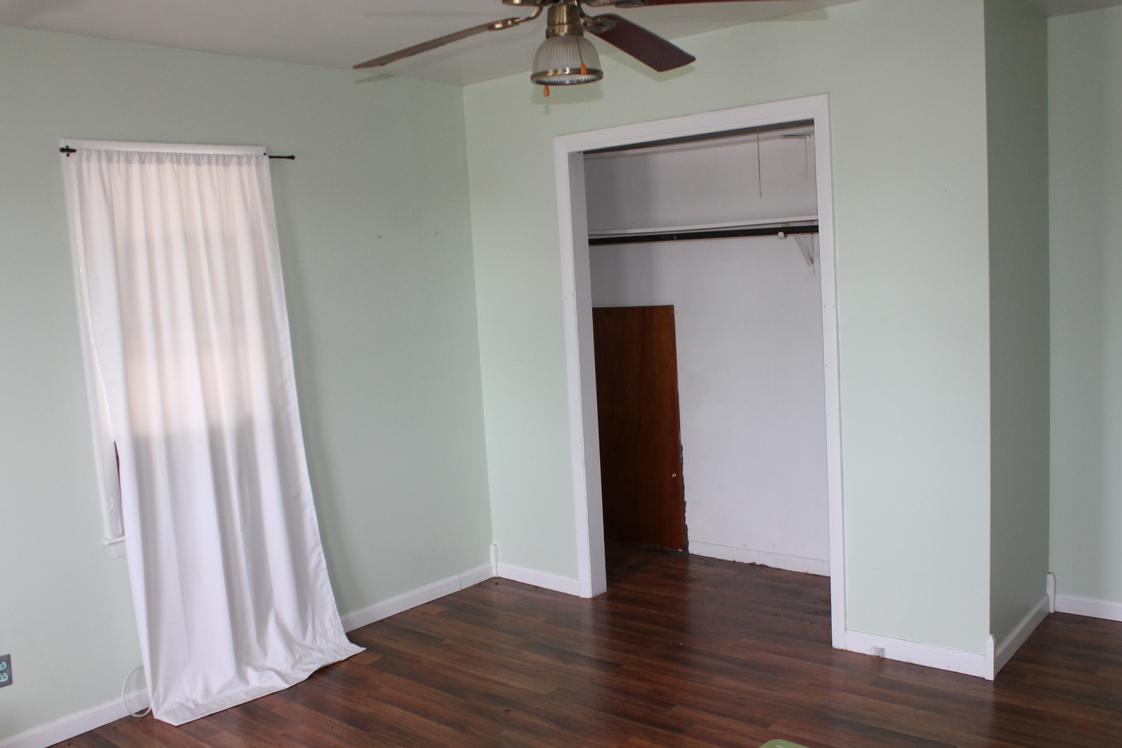 16038 Quigley Road Sycamore, IL 60178 - Photo 41 of 42 a view of an empty room with wooden floor and a window