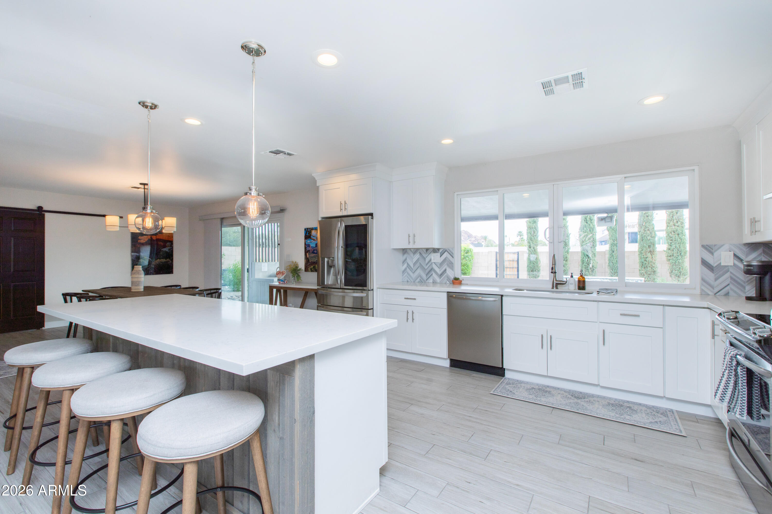 5541 East Cheery Lynn Road Phoenix, AZ 85018 - Photo 17 of 69 a large kitchen with a table and chairs