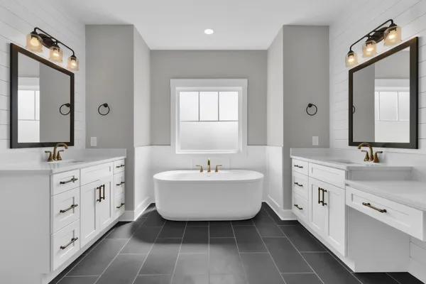a bathroom with a double vanity sink mirror and shower
