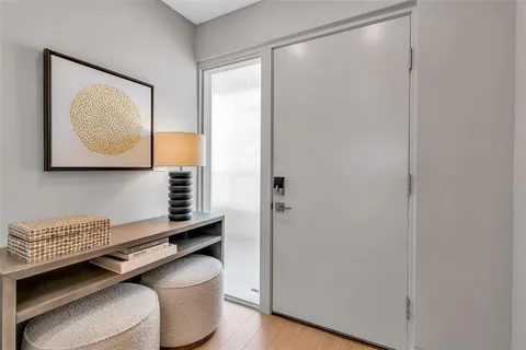 a kitchen with granite countertop white cabinets and black appliances