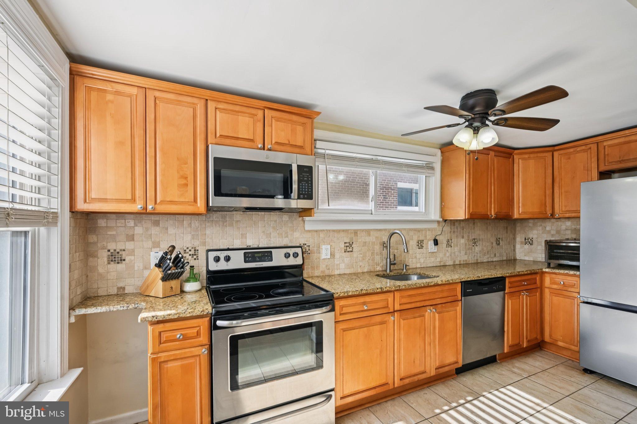 236 Cambridge Road Clifton Heights, PA 19018 - Photo 13 of 39 Modern kitchen with warm wood cabinetry.