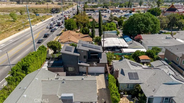 an aerial view of residential houses with outdoor space