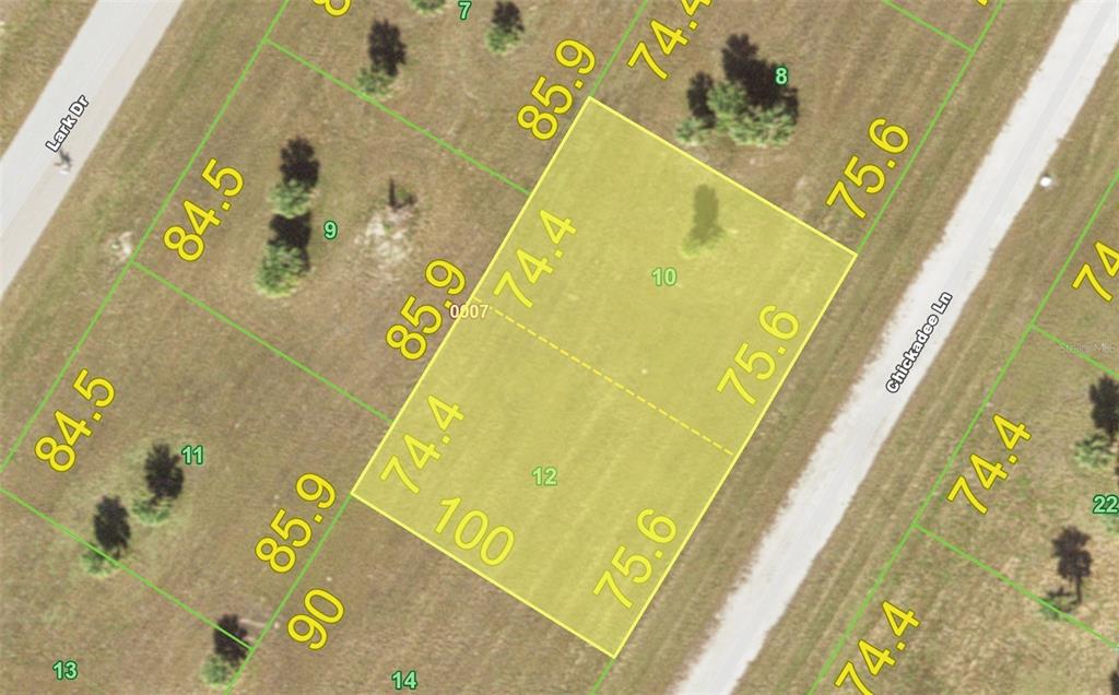 7 Chickadee Lane Placida, FL 33946 - Photo 5 of 13 a blue sign that is sitting on a white