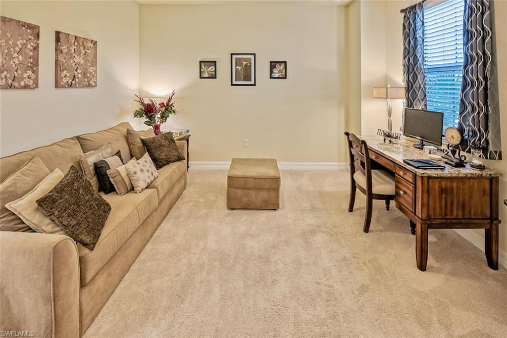 9415 Piacere Way Naples, FL 34113 - Photo 11 of 35 a living room with furniture and a window
