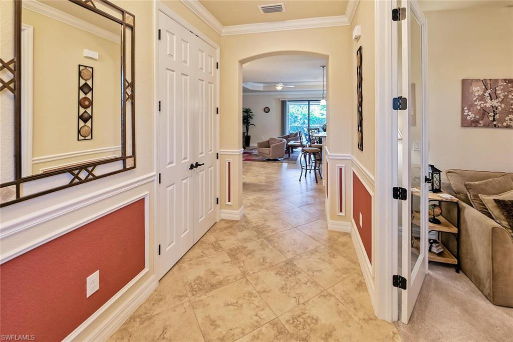 9415 Piacere Way Naples, FL 34113 - Photo 3 of 35 a view of a hallway with living room