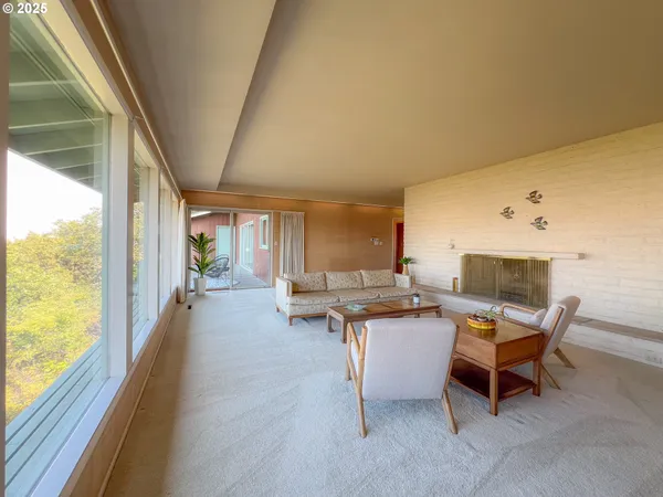 a view of a dining room with furniture window and outside view