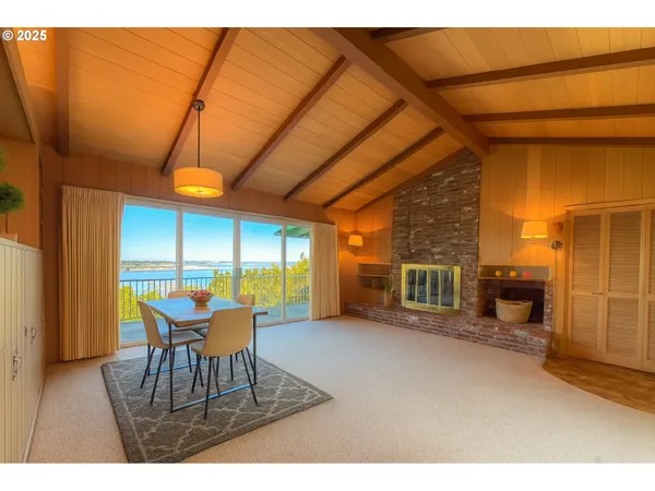 a view of a room with furniture and a window