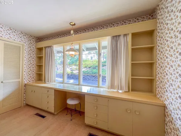 a room with window and furniture