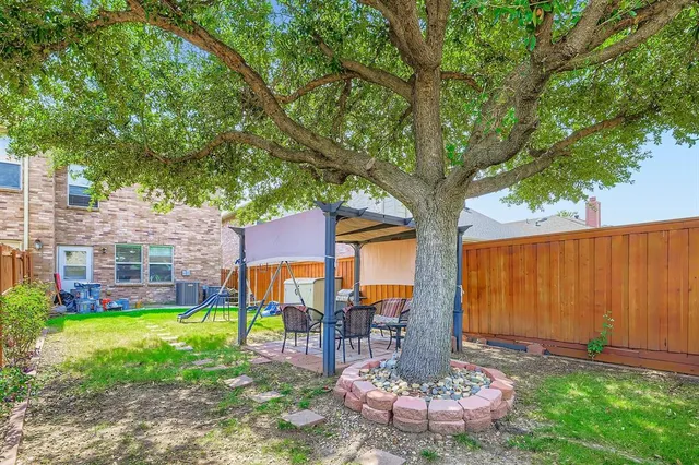 a view of a garden with a tree