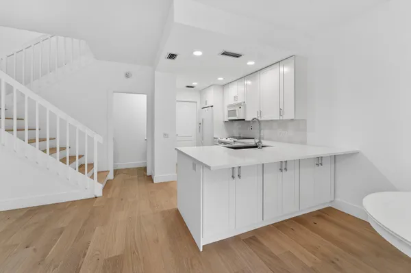 a view of a kitchen with a sink