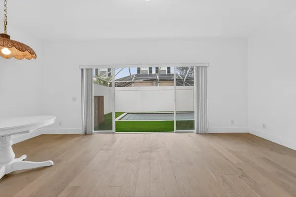 a view of empty room with floor to ceiling window