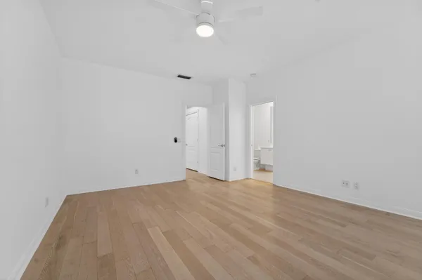 a spacious bathroom with a double vanity sink mirror double and shower