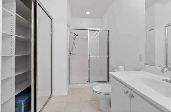 a view of walk in closet with empty racks