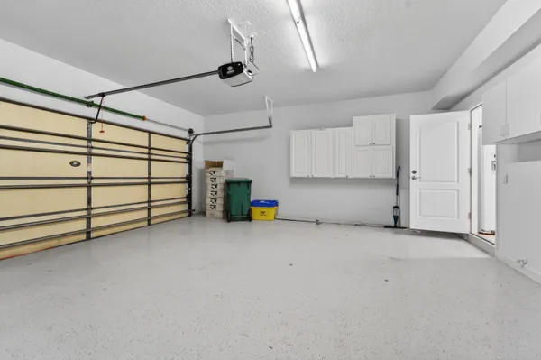 an aerial view of residential house with outdoor space and swimming pool