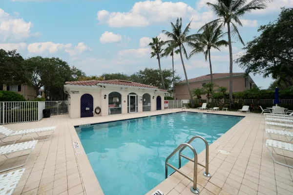 a view of a swimming pool with a patio