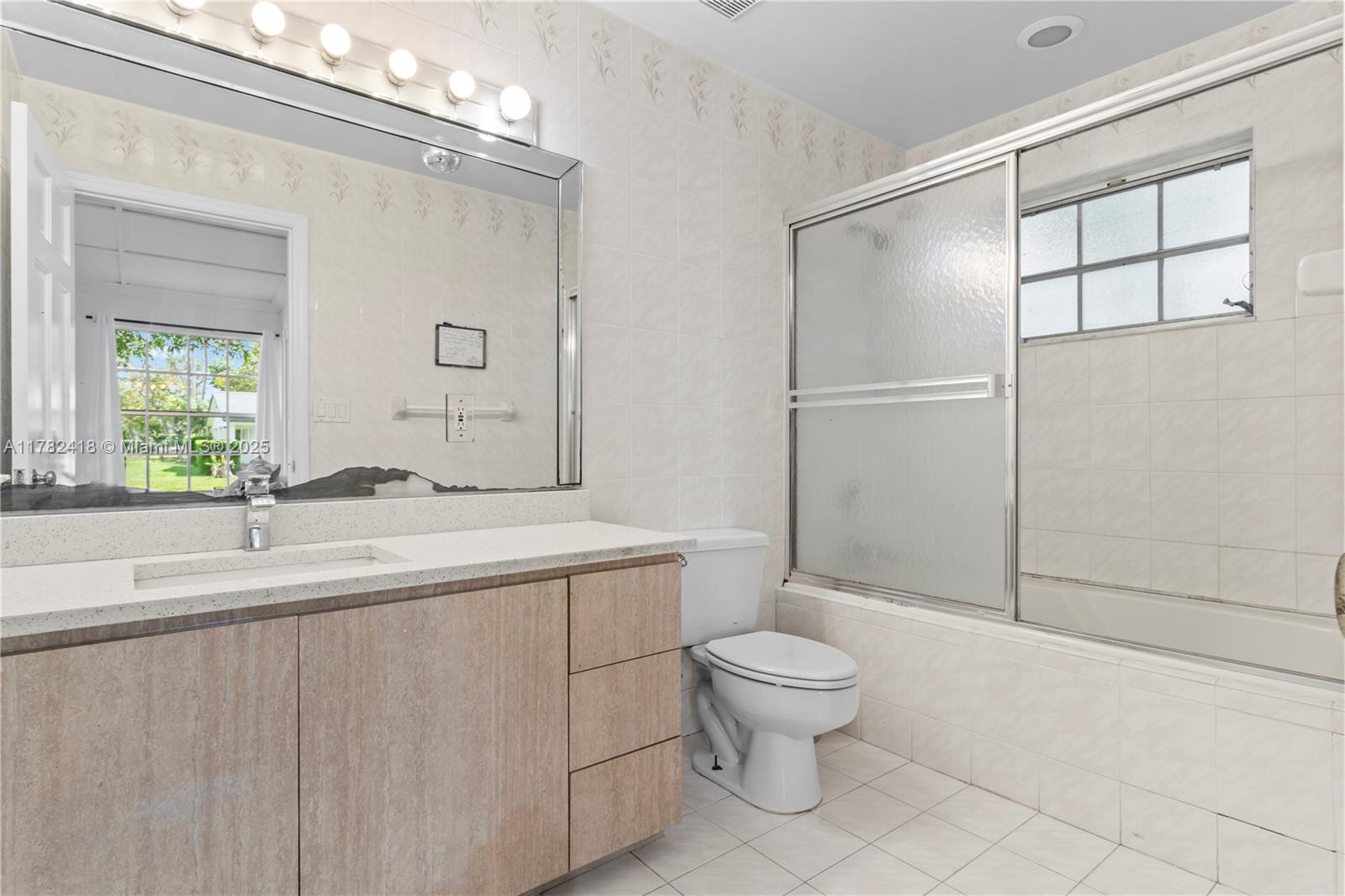 8350 Southwest 98th Street Miami, FL 33156 - Photo 19 of 67 a bathroom with a sink a toilet and shower