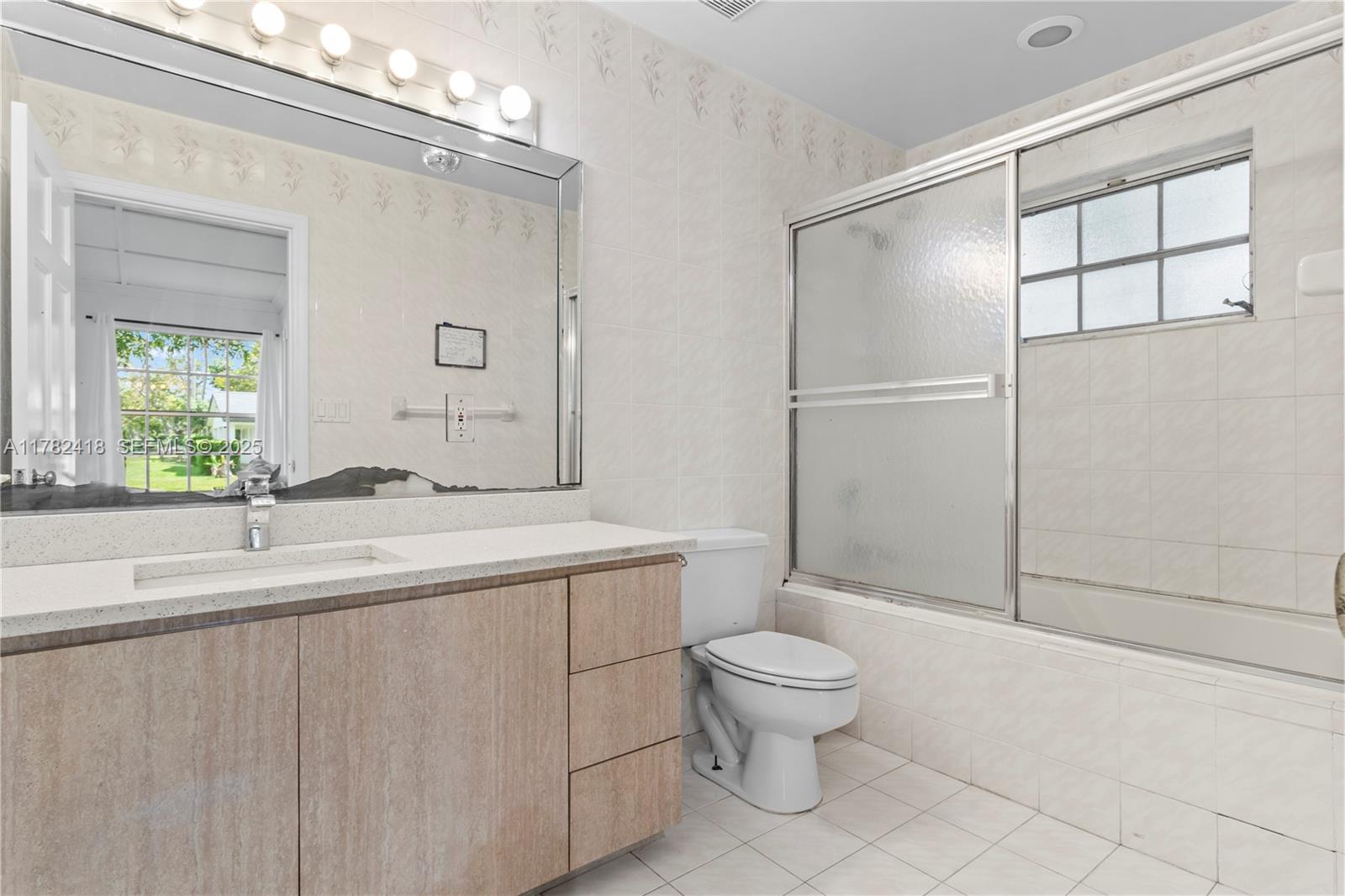 8350 Southwest 98th Street Miami, FL 33156 - Photo 19 of 67 a bathroom with a sink a toilet and shower