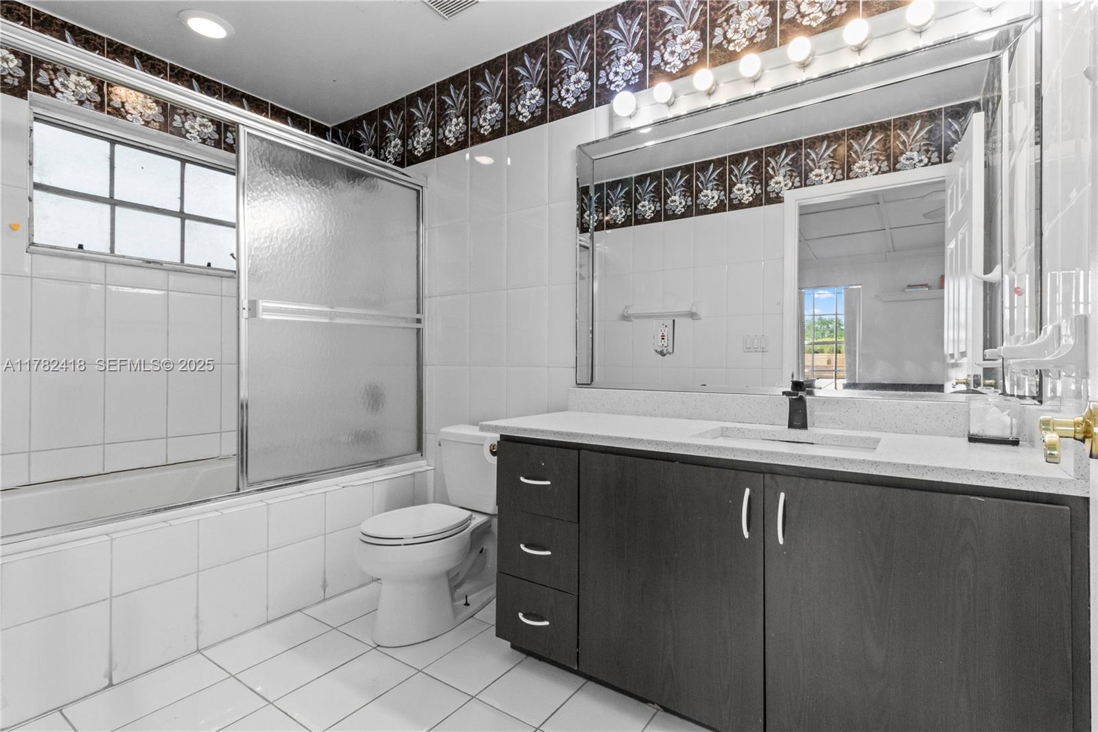 8350 Southwest 98th Street Miami, FL 33156 - Photo 20 of 67 a spacious bathroom with a shower sink mirror and toilet