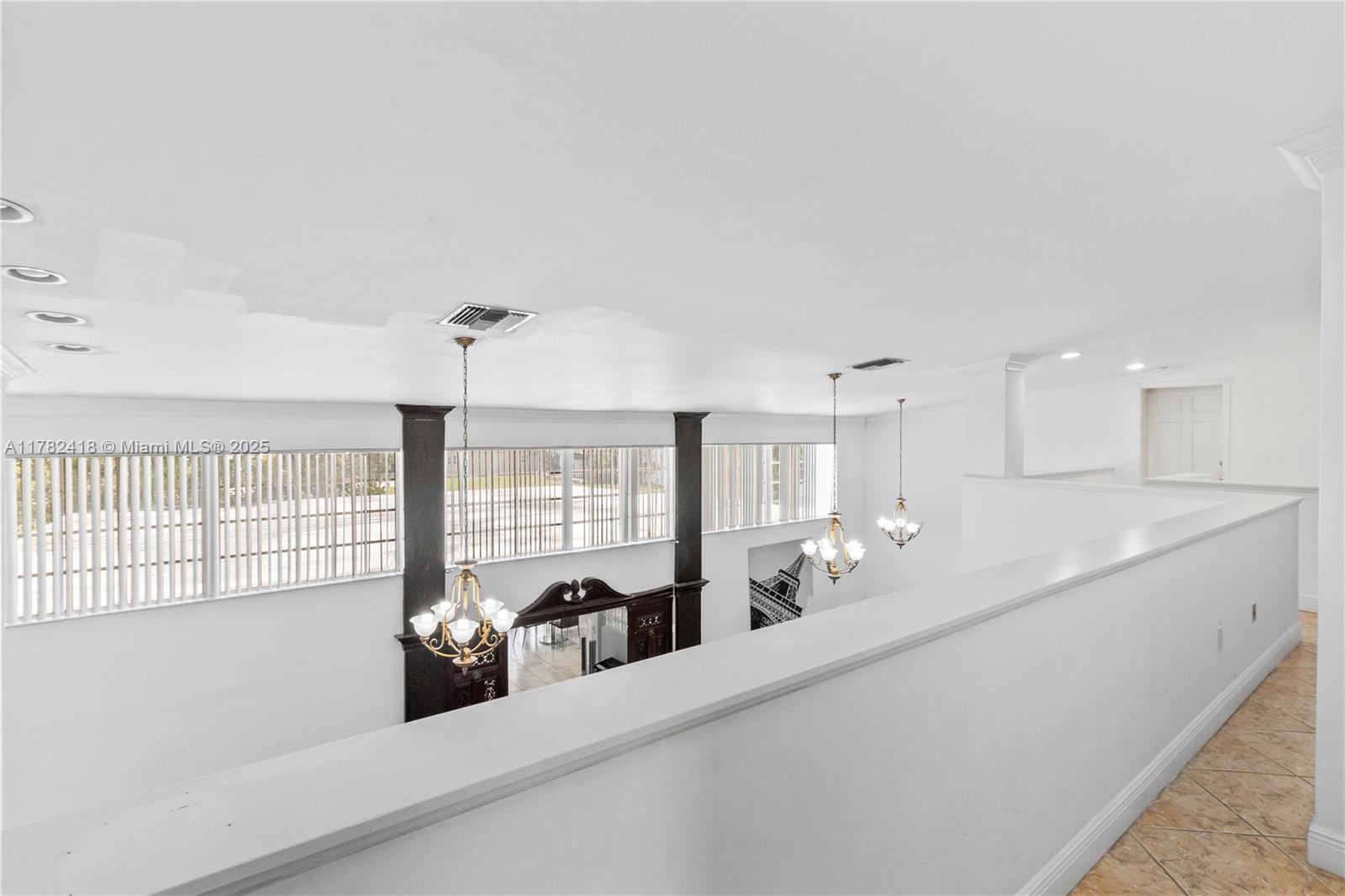 8350 Southwest 98th Street Miami, FL 33156 - Photo 29 of 67 a large white kitchen with a large window
