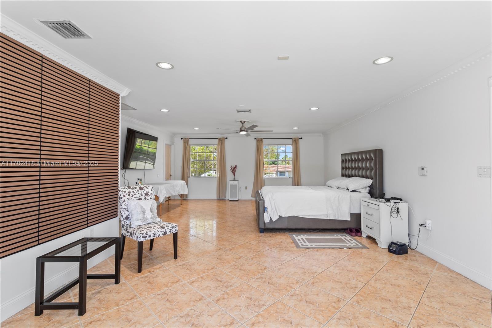 8350 Southwest 98th Street Miami, FL 33156 - Photo 32 of 67 a living room with furniture and a flat screen tv