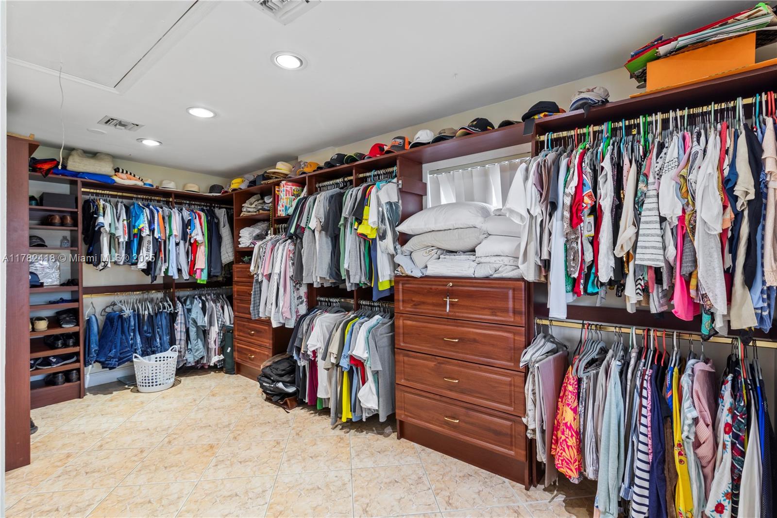 8350 Southwest 98th Street Miami, FL 33156 - Photo 33 of 67 a view of walk in closet with clothes and shoes